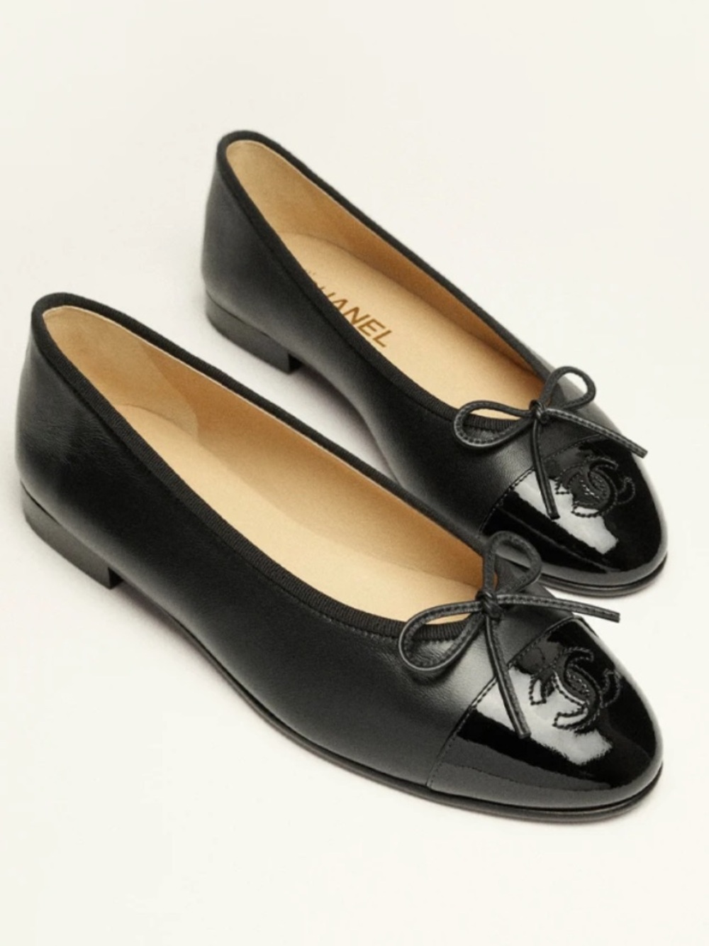 CHANEL Black Leather Cap-Toe Ballet Flats with Bow